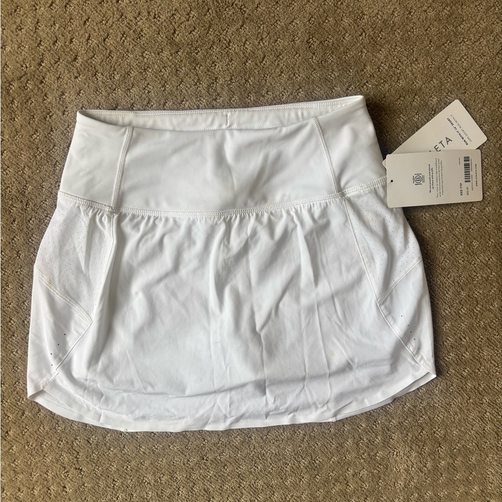 Athleta girls white “run with it” 14 inch skort NWT